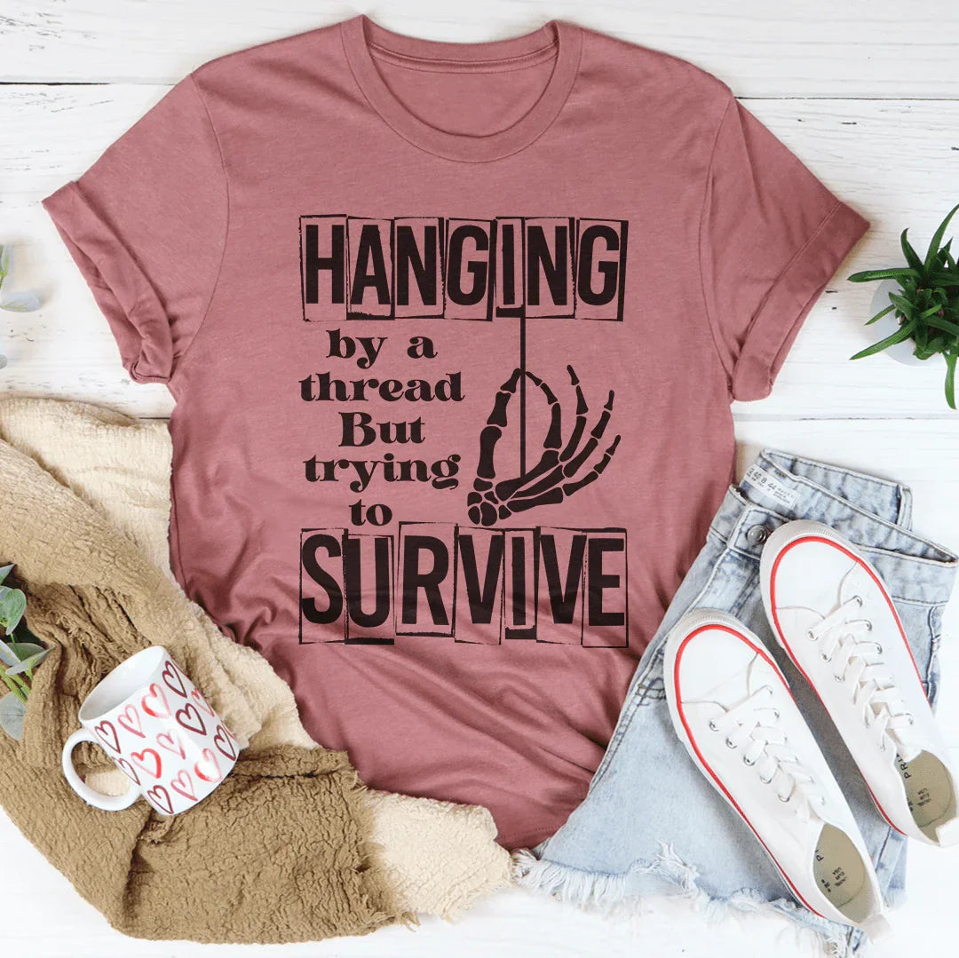 Hanging By A Thread But Trying To Survive Tee - WonderingCloth
