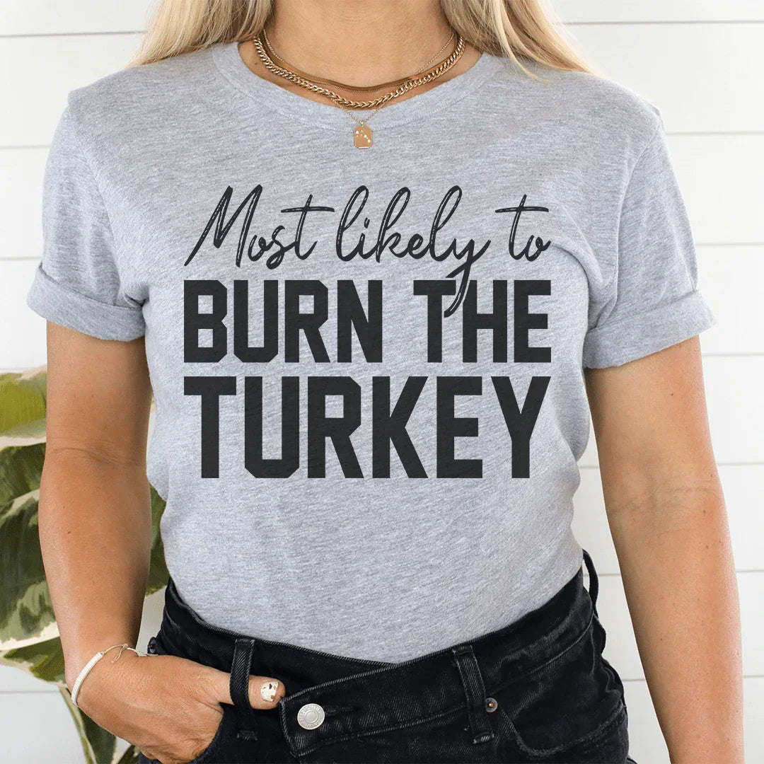 Most Likely To Burn The Turkey Thanksgiving Tee - WonderingCloth