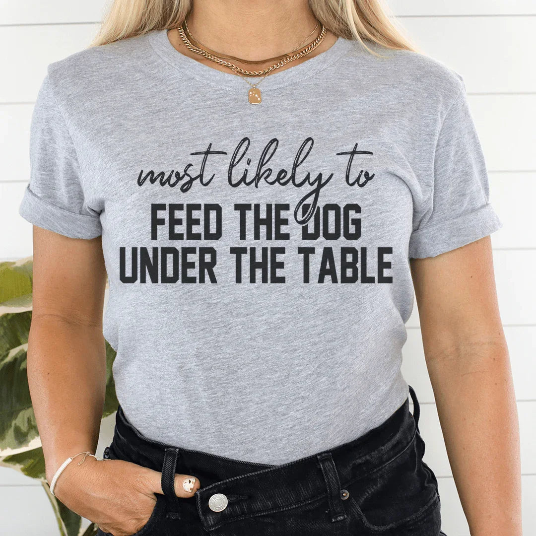 Most Likely To Feed The Dog Under The Table Thanksgiving Tee - WonderingCloth