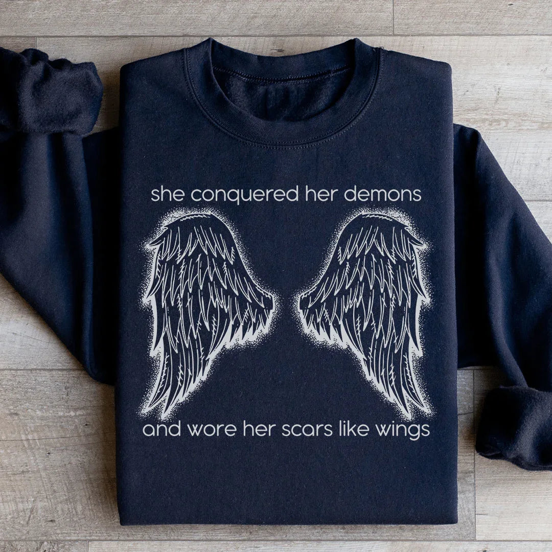 She Conquered Her Demons And Wore Her Scars Like Wings Sweatshirt - WonderingCloth