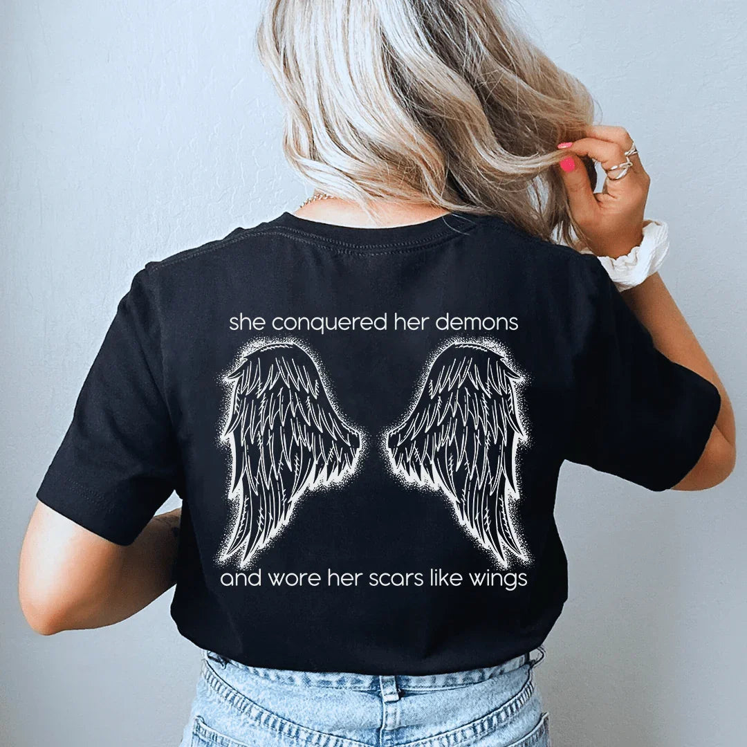She Conquered Her Demons And Wore Her Scars Like Wings Tee - WonderingCloth